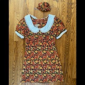 Miracle Eye marigold mini dress and mask